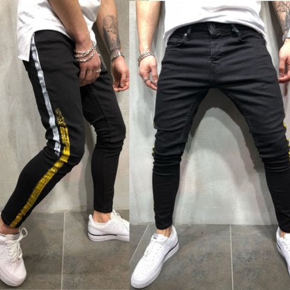 Pantalon slim noir en denim imprimé à rayures