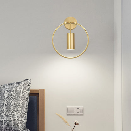 Round golden wall lamp