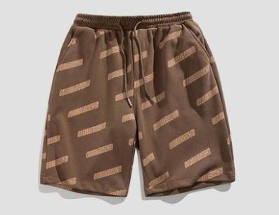 Monos estampados Pantalones cortos Tendencia de los hombres Pantalones de playa casuales Pantalones de chándal sueltos con cordón