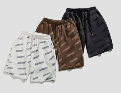 Monos estampados Pantalones cortos Tendencia de los hombres Pantalones de playa casuales Pantalones de chándal sueltos con cordón